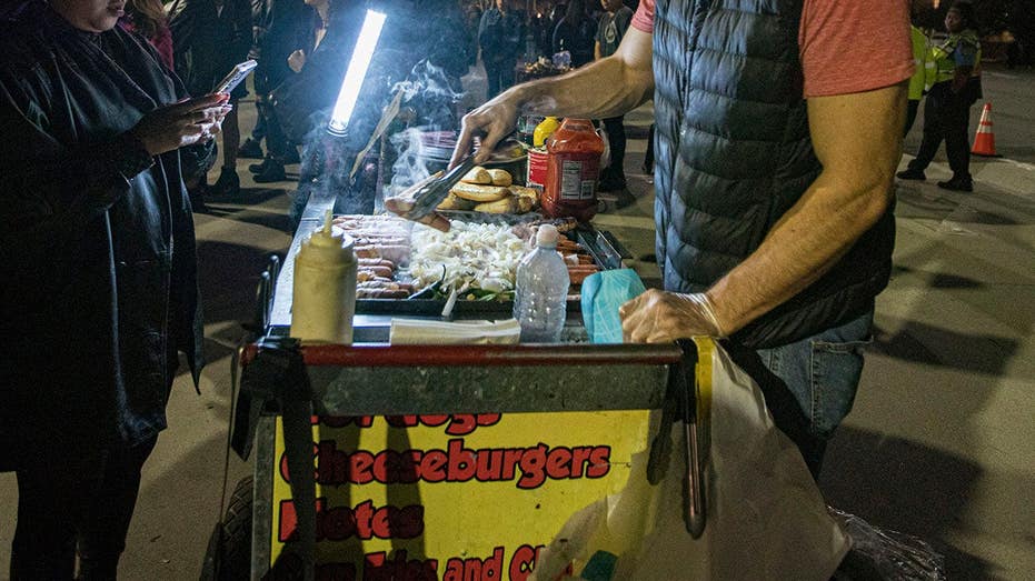 A heated hot dog vendor turf war leads to a sidewalk brawl between two female wiener slingers