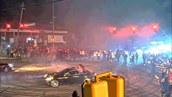 WATCH: Illegal street racing 'takeover' explodes as hundreds swarm streets and suspects bolt